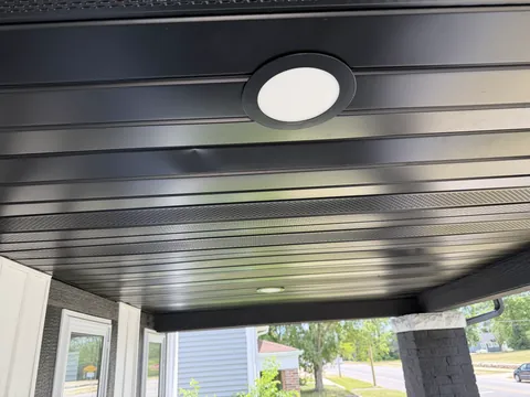 Dark porch ceiling with a round light