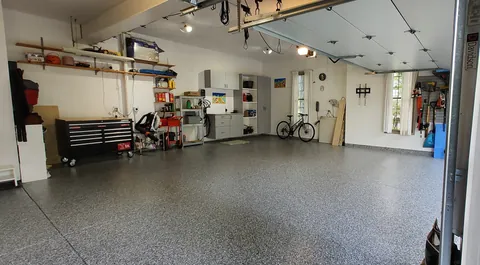 Speckled floor across a garage interior