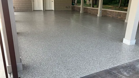 Speckled floor through a doorway with columns
