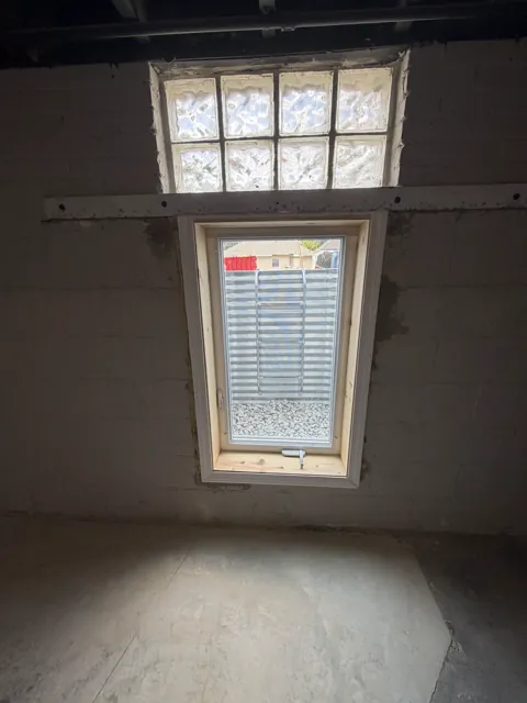 Basement window with an exterior window well