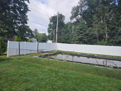 White privacy fence around a yard