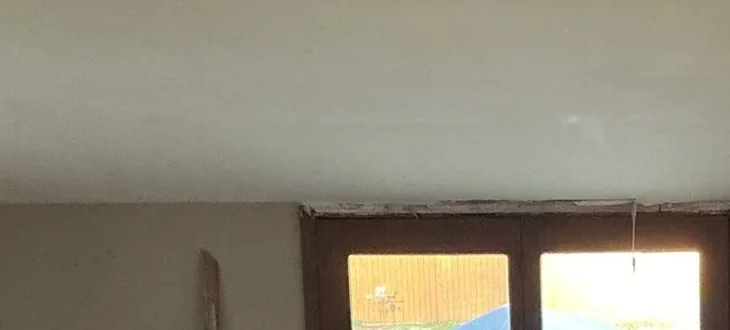 Upper wall and glazed doors during renovation