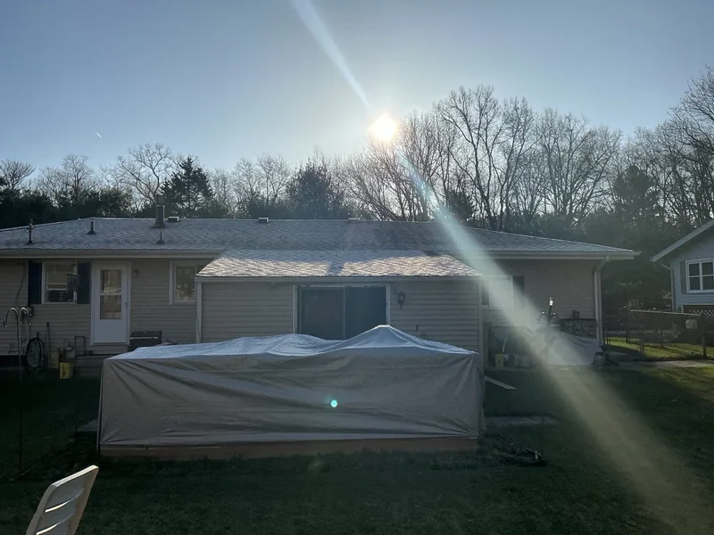Rear exterior with a low roof extension and covered outdoor area